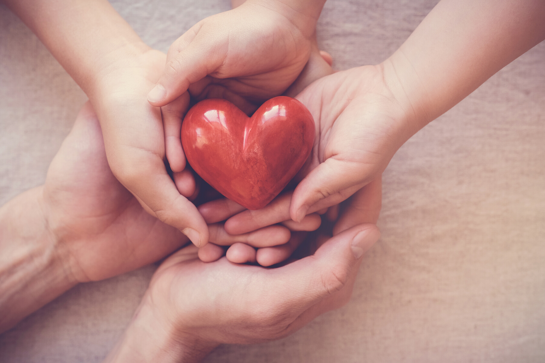 Hands holding heart for Heart Awareness Month